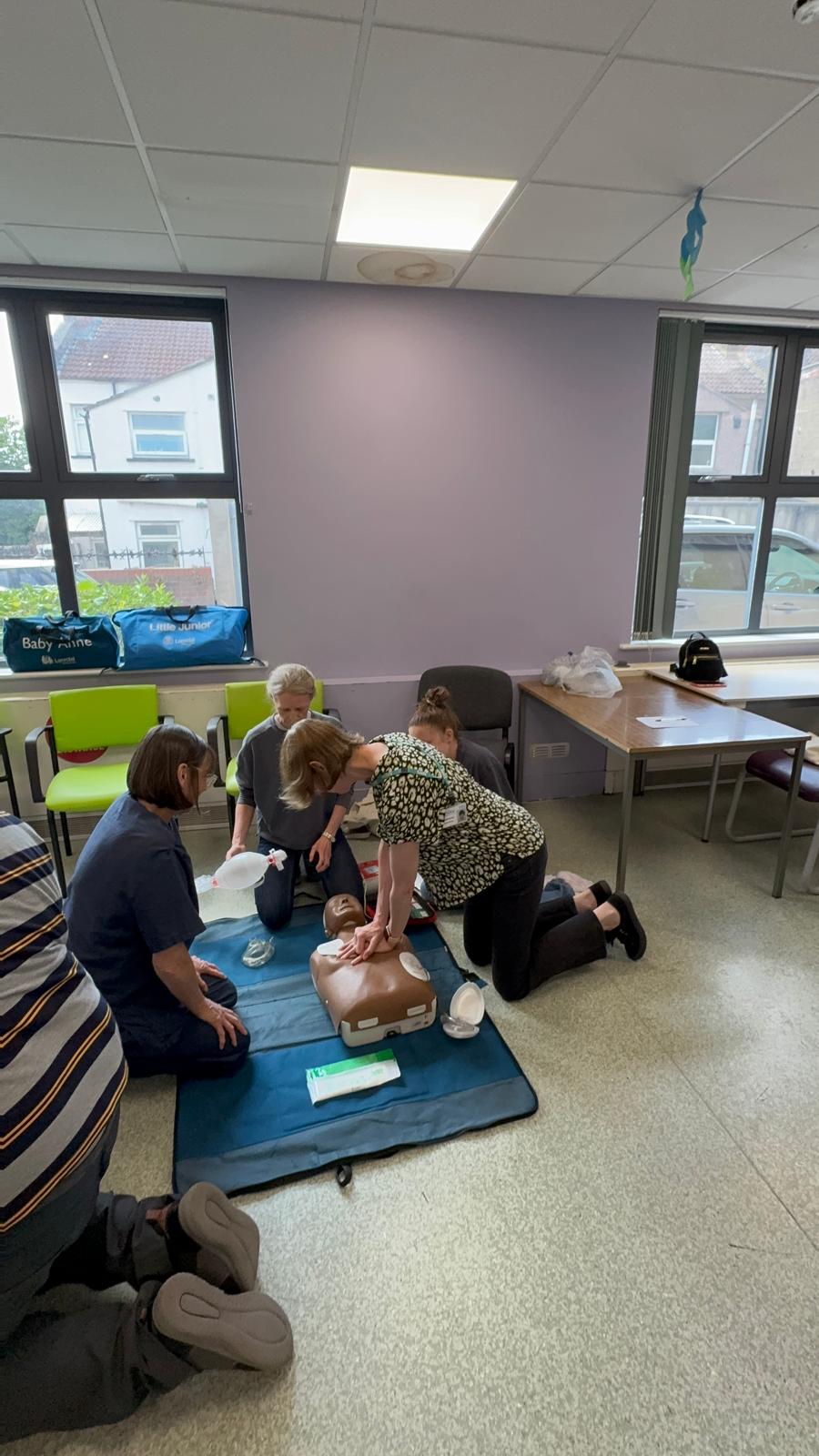 Learners taking part in a hands-on CPR training session