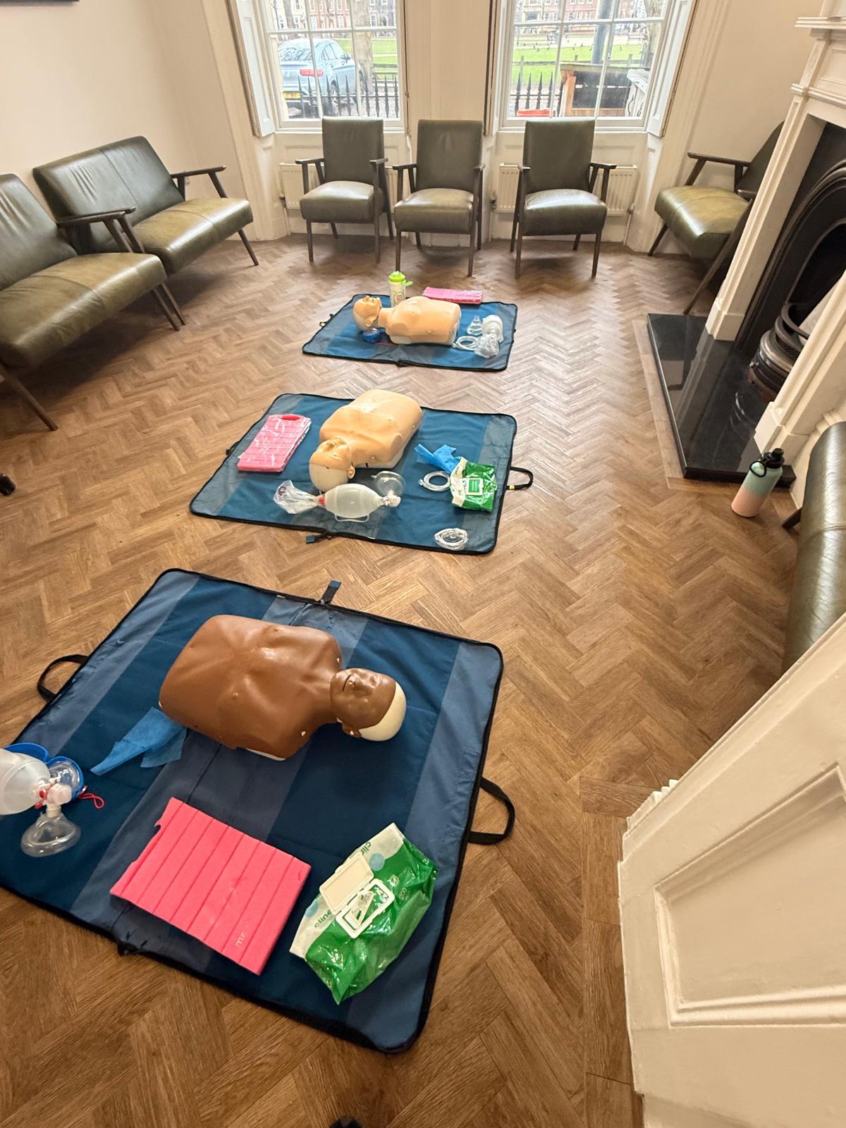 Practical CPR equipment arranged for hands-on BLS learner practice